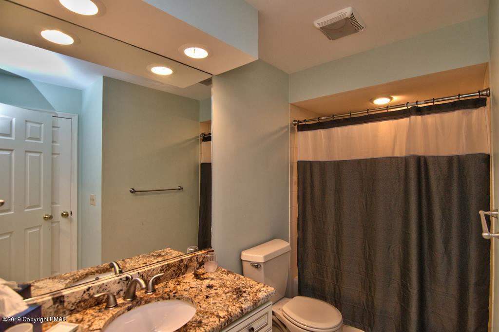 2169 Fox Run Road Stroudsburg, PA 18360 - Photo 51 of 66 a bathroom with a sink and a mirror