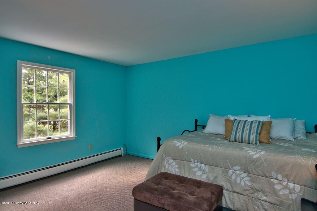 2169 Fox Run Road Stroudsburg, PA 18360 - Photo 52 of 66 a bedroom with a bed and a window