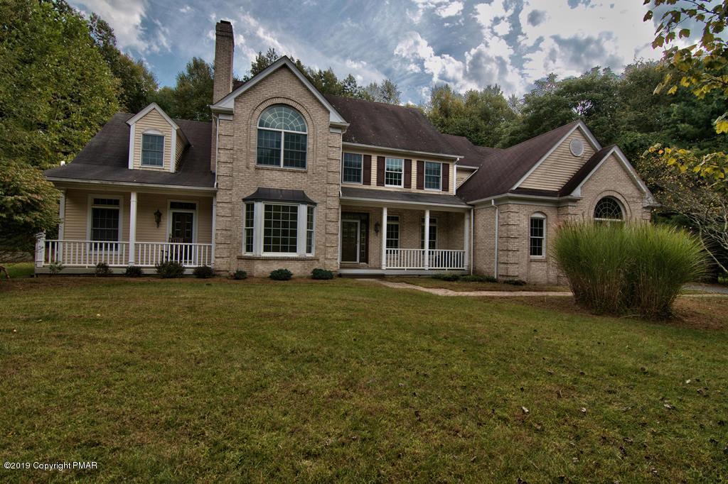 2169 Fox Run Road Stroudsburg, PA 18360 - Photo 59 of 66 a front view of a house with a garden