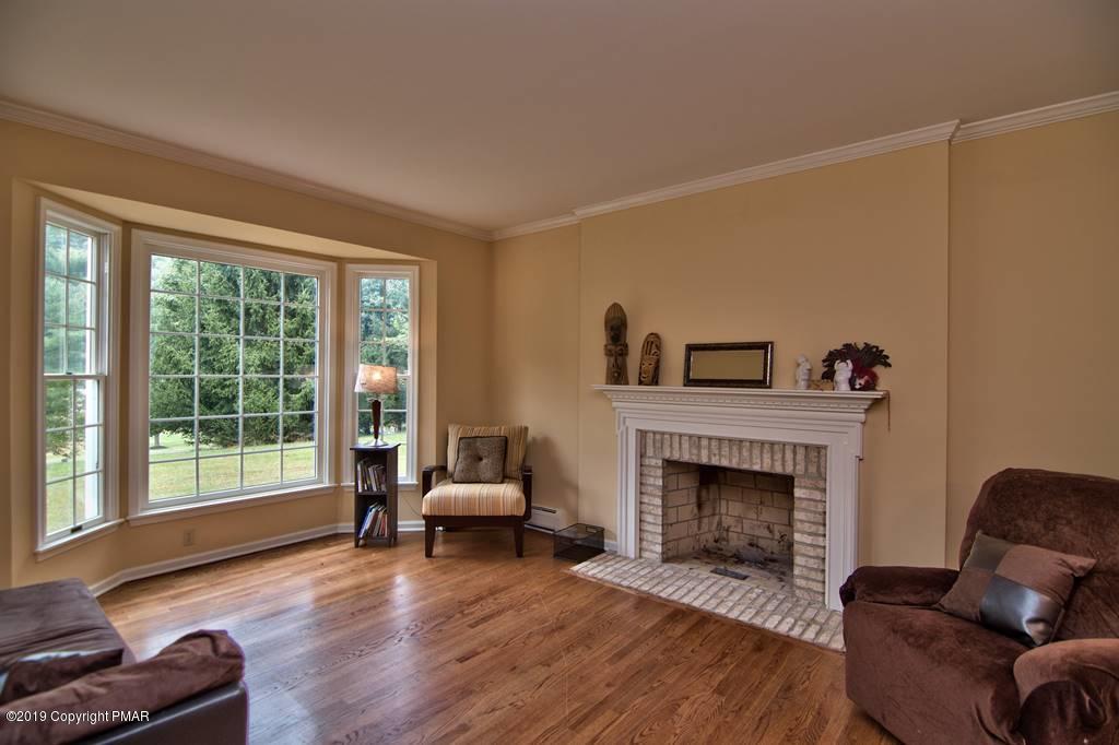 2169 Fox Run Road Stroudsburg, PA 18360 - Photo 6 of 66 a living room with furniture and a fireplace