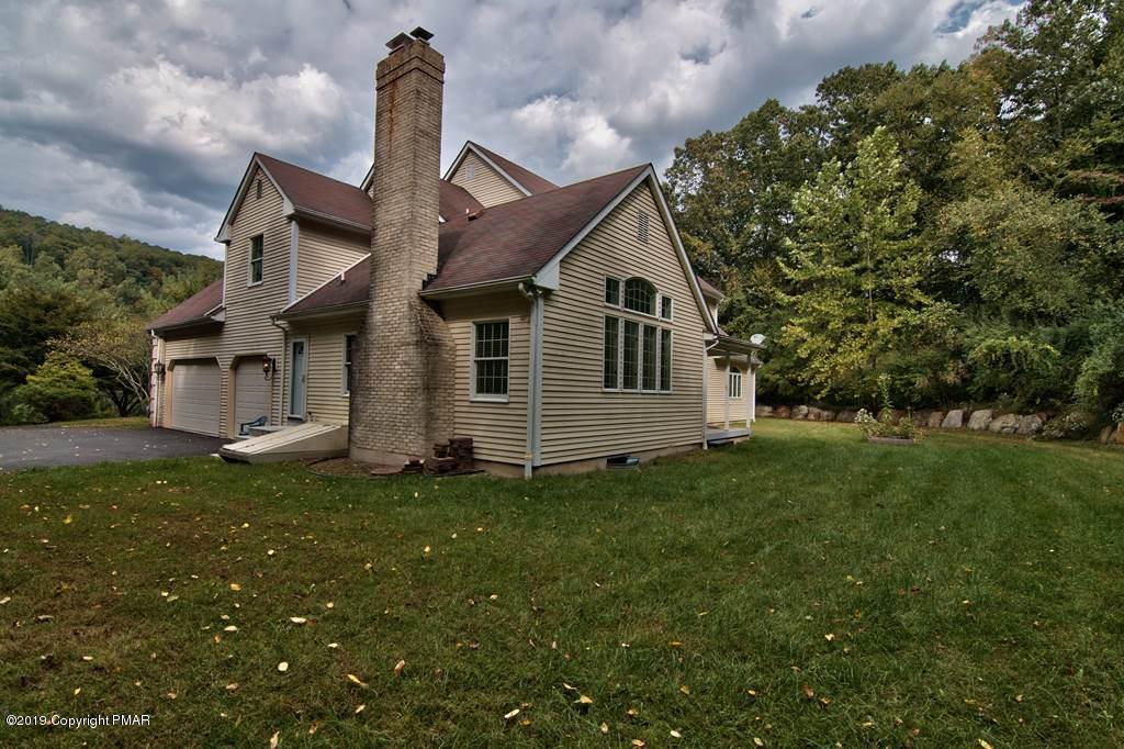 2169 Fox Run Road Stroudsburg, PA 18360 - Photo 66 of 66 a front view of a house with a garden