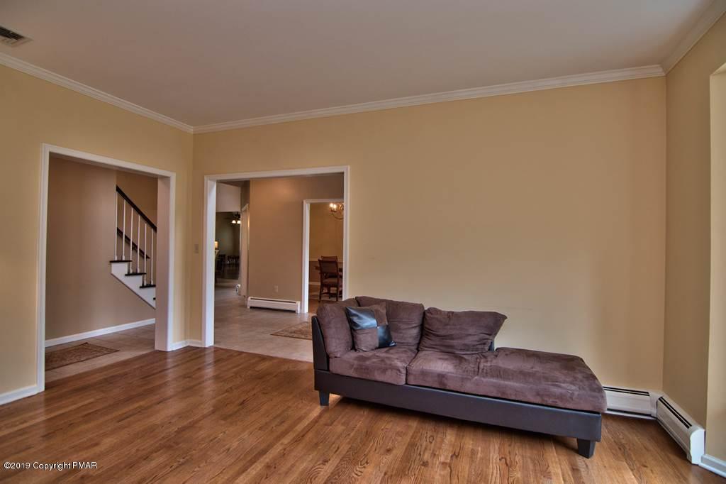 2169 Fox Run Road Stroudsburg, PA 18360 - Photo 8 of 66 a living room with furniture and a wooden floor