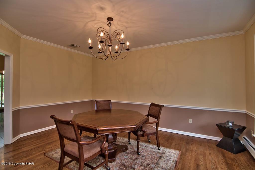 2169 Fox Run Road Stroudsburg, PA 18360 - Photo 10 of 66 a view of a dining room with furniture and wooden floor
