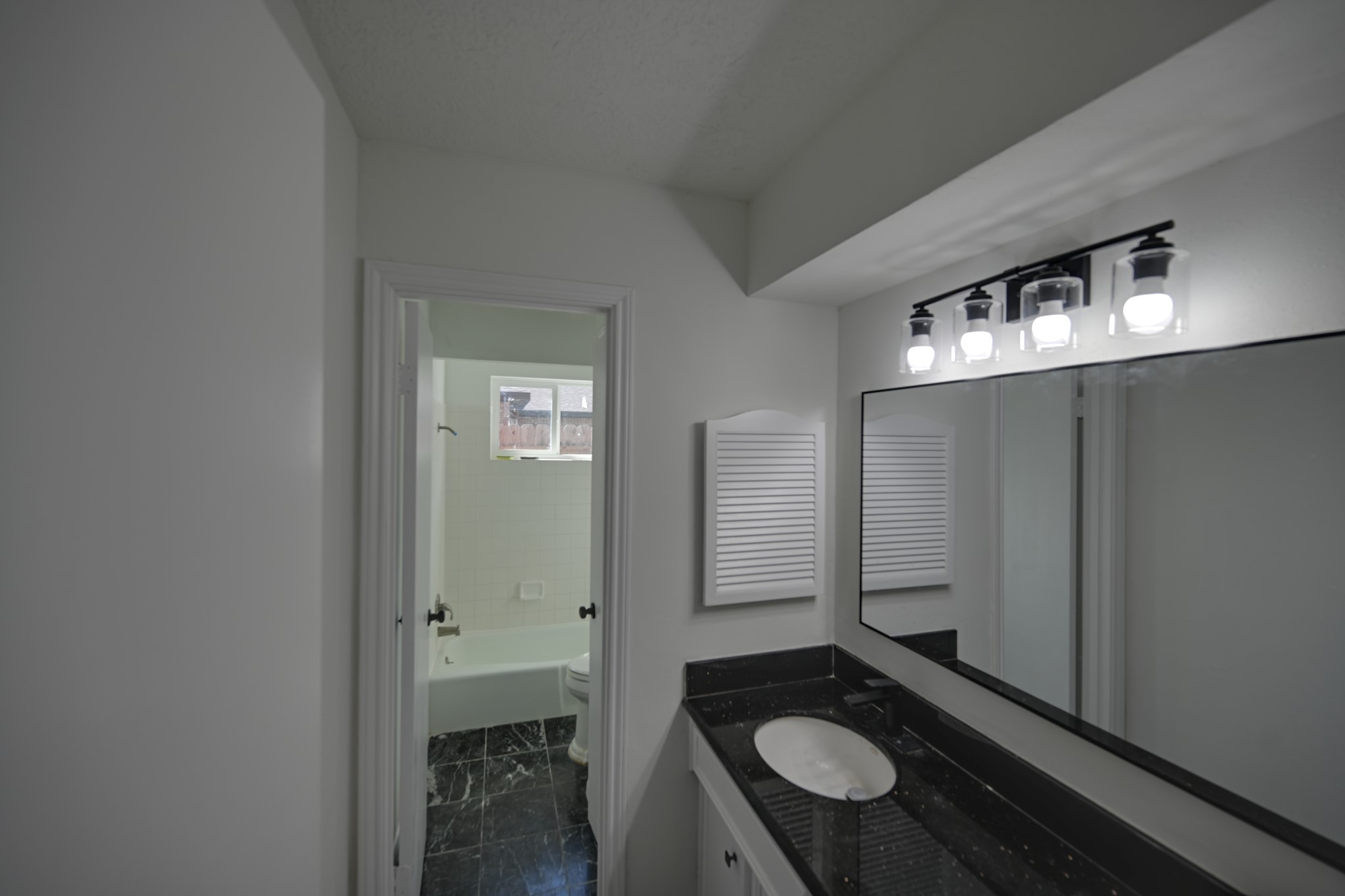 10410 Cook Road Houston, TX 77099 - Photo 9 of 14 a bathroom with a sink and a mirror