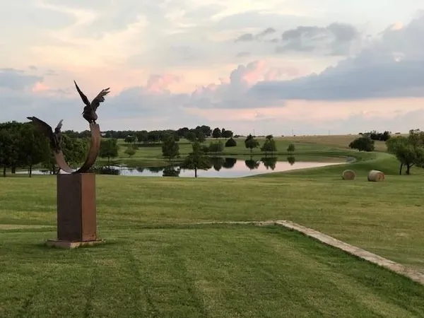 a view of a lake with a big yard