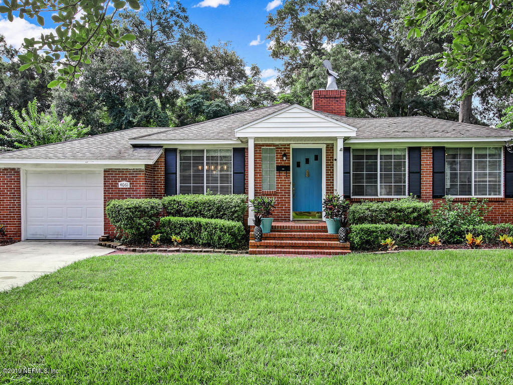 4061 Dover Road Jacksonville, FL 32207 - Photo 1 of 40 a front view of a house with a yard