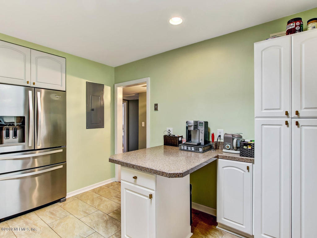 4061 Dover Road Jacksonville, FL 32207 - Photo 13 of 40 a kitchen with a sink and refrigerator