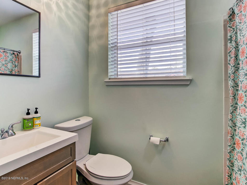 4061 Dover Road Jacksonville, FL 32207 - Photo 28 of 40 a white toilet sitting next to a bathroom sink