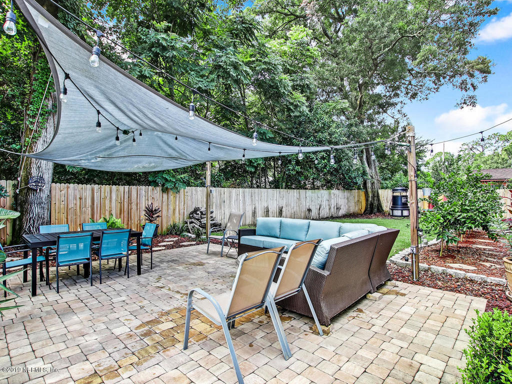 4061 Dover Road Jacksonville, FL 32207 - Photo 32 of 40 a view of backyard with outdoor seating a patio and plants