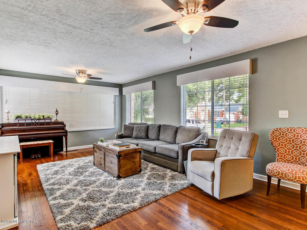 4061 Dover Road Jacksonville, FL 32207 - Photo 10 of 40 a living room with furniture and a fireplace