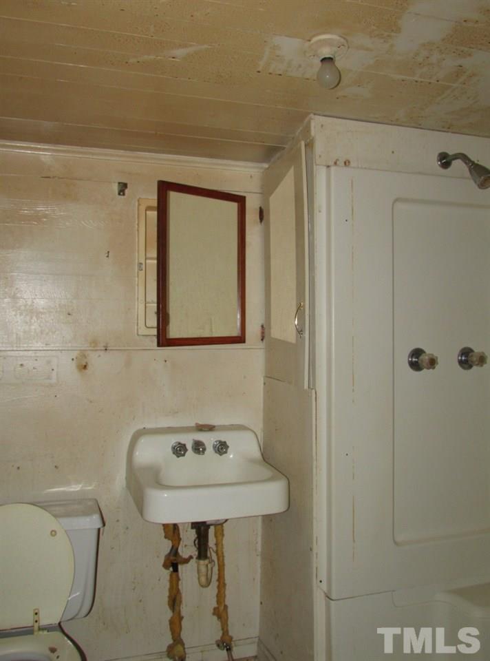 Bath has a stall shower