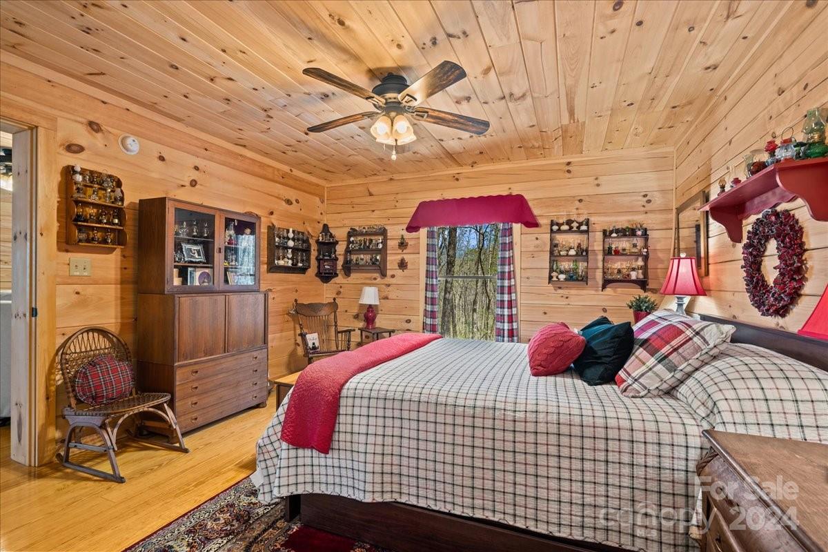 440 Jervey Road Landrum, SC 29356 - Photo 13 of 29 a bedroom with a bed and ceiling fan