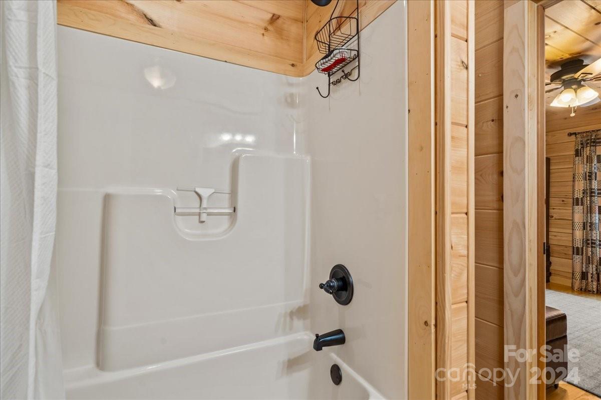 440 Jervey Road Landrum, SC 29356 - Photo 17 of 29 a bathroom with a bathtub and shower