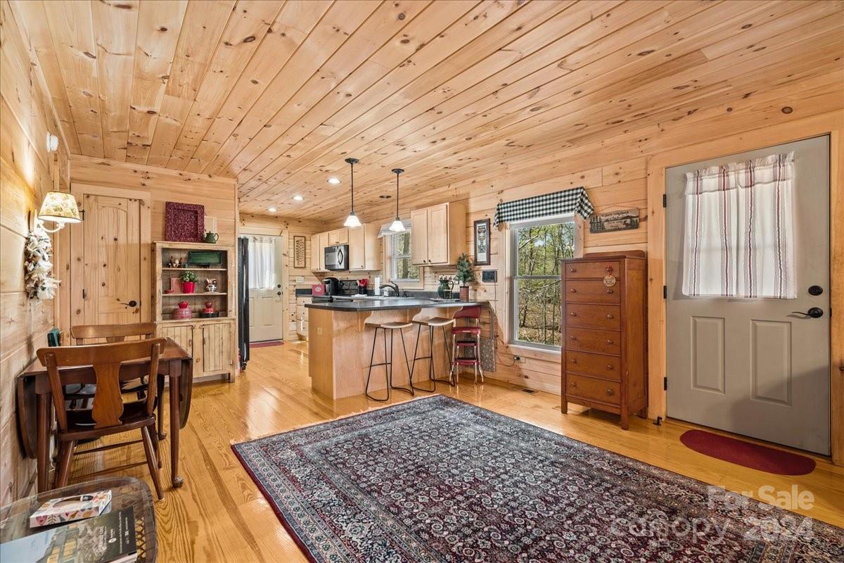 440 Jervey Road Landrum, SC 29356 - Photo 20 of 29 a living room with stainless steel appliances kitchen island granite countertop furniture and a kitchen view