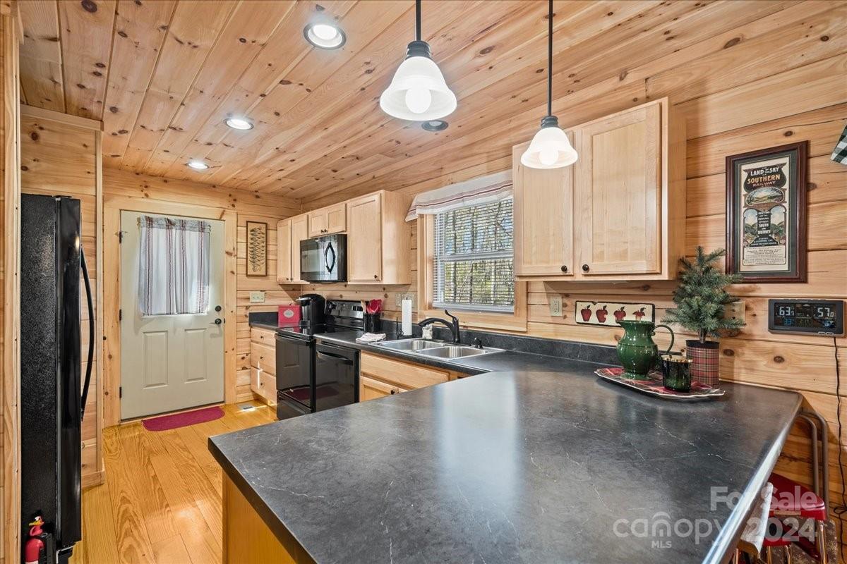 440 Jervey Road Landrum, SC 29356 - Photo 22 of 29 a kitchen with sink refrigerator and window