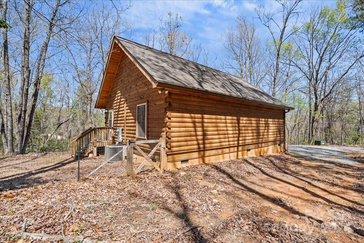 440 Jervey Road Landrum, SC 29356 - Photo 28 of 29 a backyard of a house with multiple trees