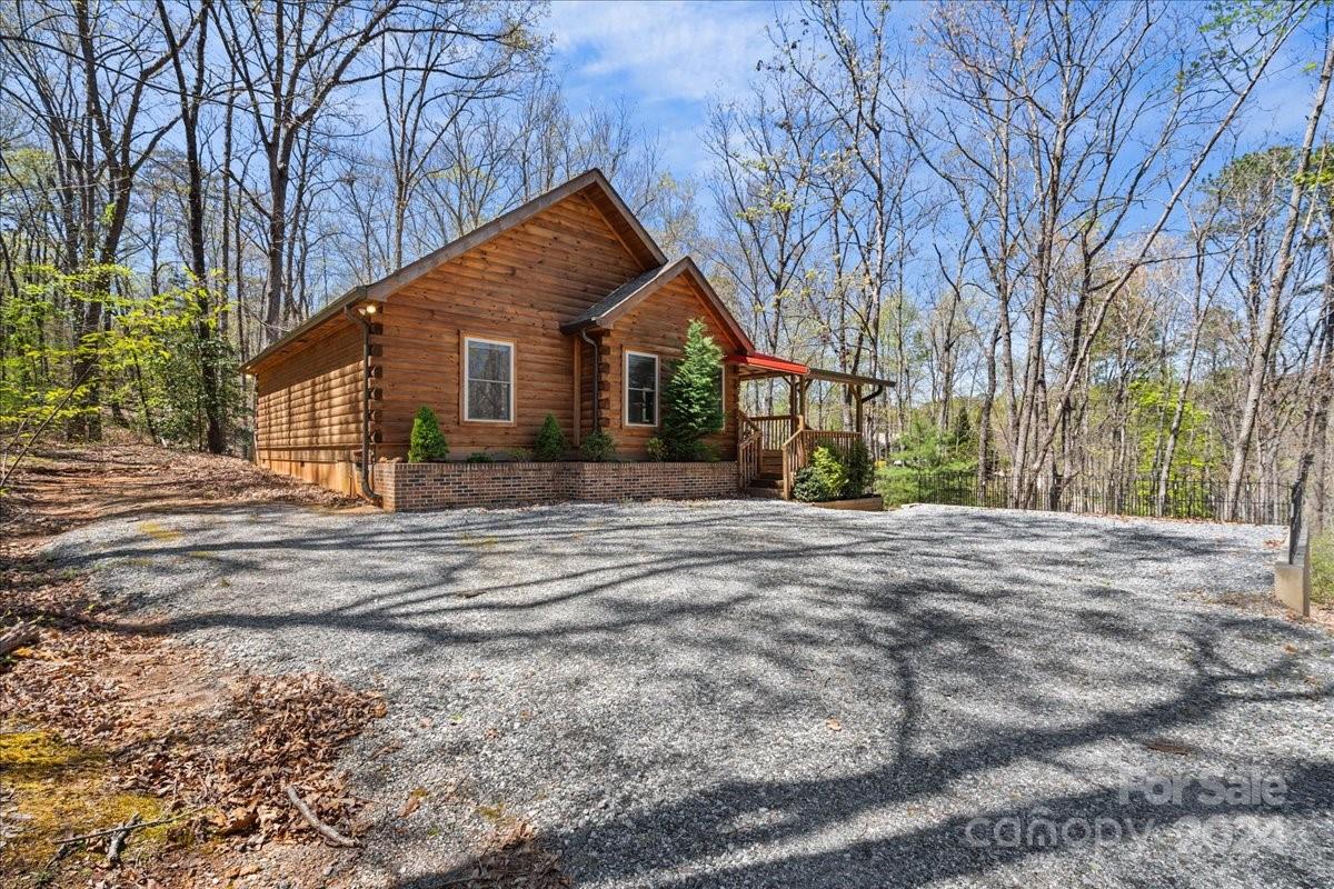 440 Jervey Road Landrum, SC 29356 - Photo 5 of 29 a house with trees in the background