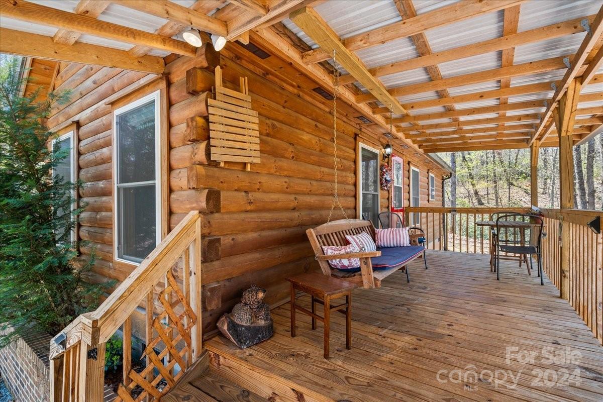 440 Jervey Road Landrum, SC 29356 - Photo 6 of 29 a roof deck with wooden floor and outdoor seating