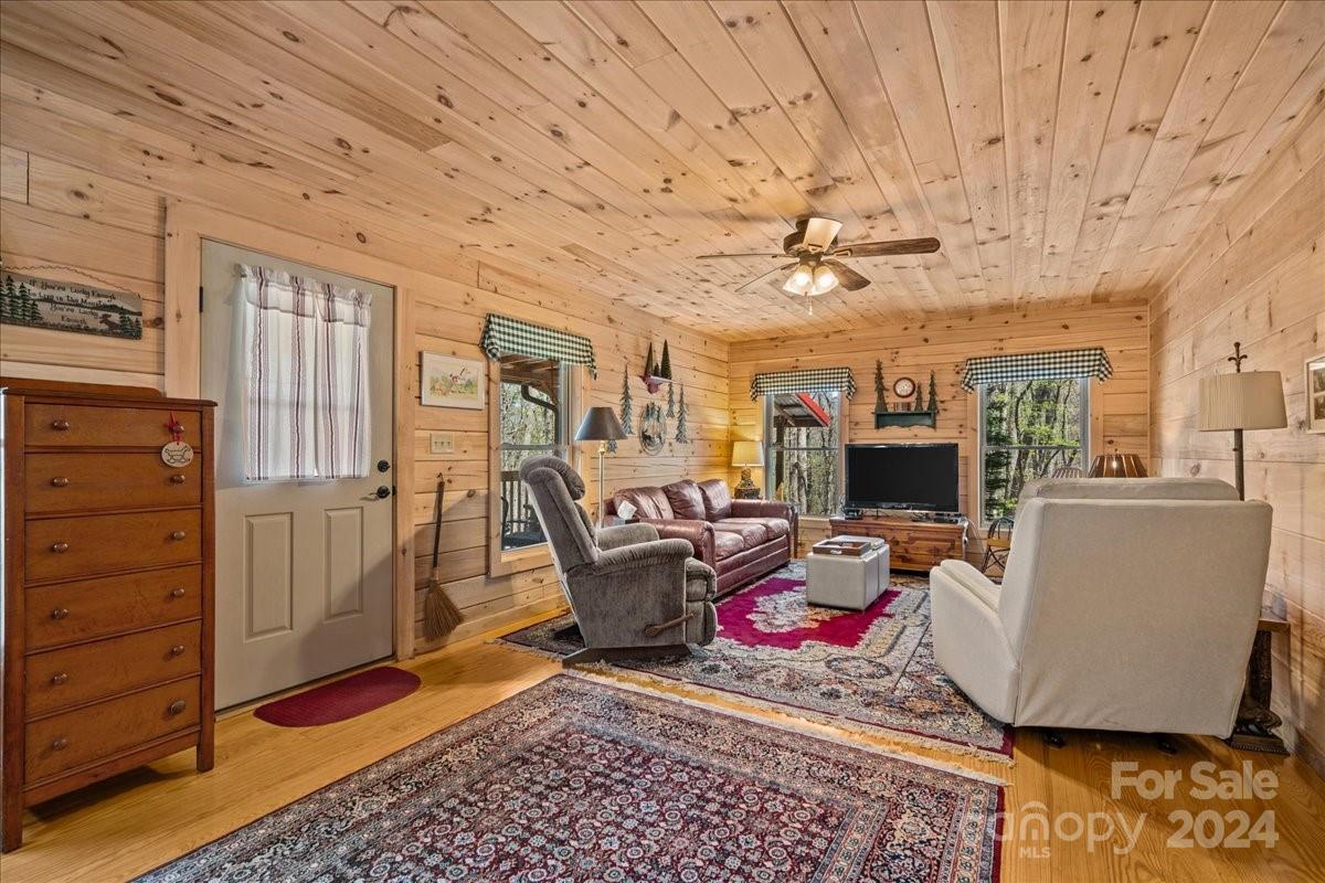 440 Jervey Road Landrum, SC 29356 - Photo 8 of 29 a living room with furniture a flat screen tv and a table