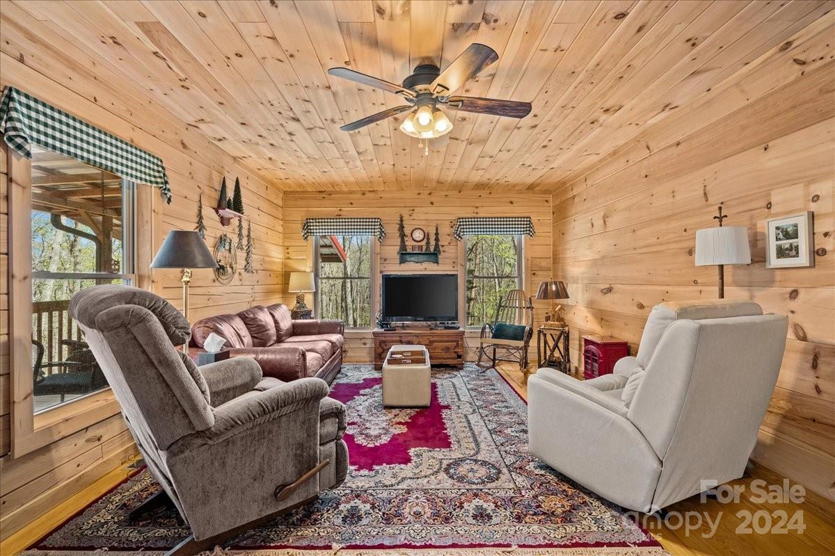 440 Jervey Road Landrum, SC 29356 - Photo 9 of 29 a living room with furniture and a chandelier