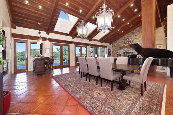 a kitchen with stainless steel appliances a stove a sink and a refrigerator