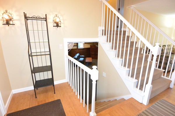 257 Neck Road Lancaster, MA 01523 - Photo 11 of 28 a view of staircase with railing and white walls