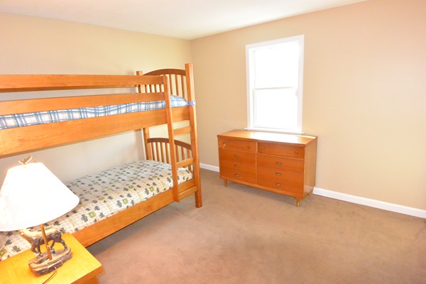 257 Neck Road Lancaster, MA 01523 - Photo 12 of 28 a bedroom with a bed and a window