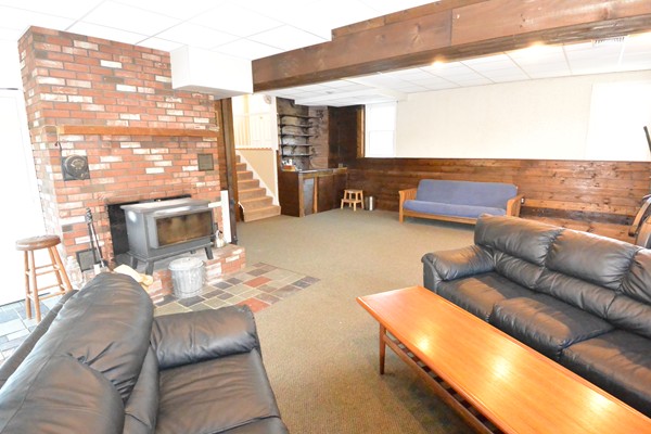 257 Neck Road Lancaster, MA 01523 - Photo 19 of 28 a living room with furniture and a fireplace