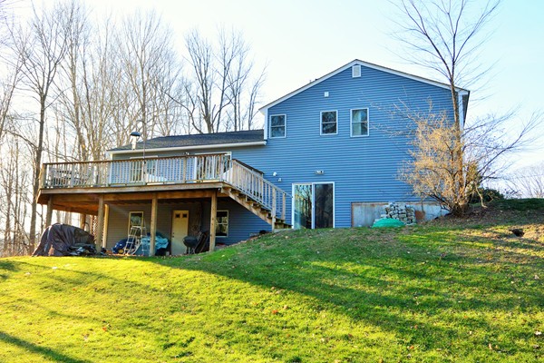 257 Neck Road Lancaster, MA 01523 - Photo 24 of 28 a front view of a house with a yard