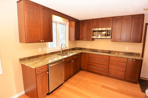 257 Neck Road Lancaster, MA 01523 - Photo 3 of 28 a kitchen with stainless steel appliances granite countertop a sink stove and microwave