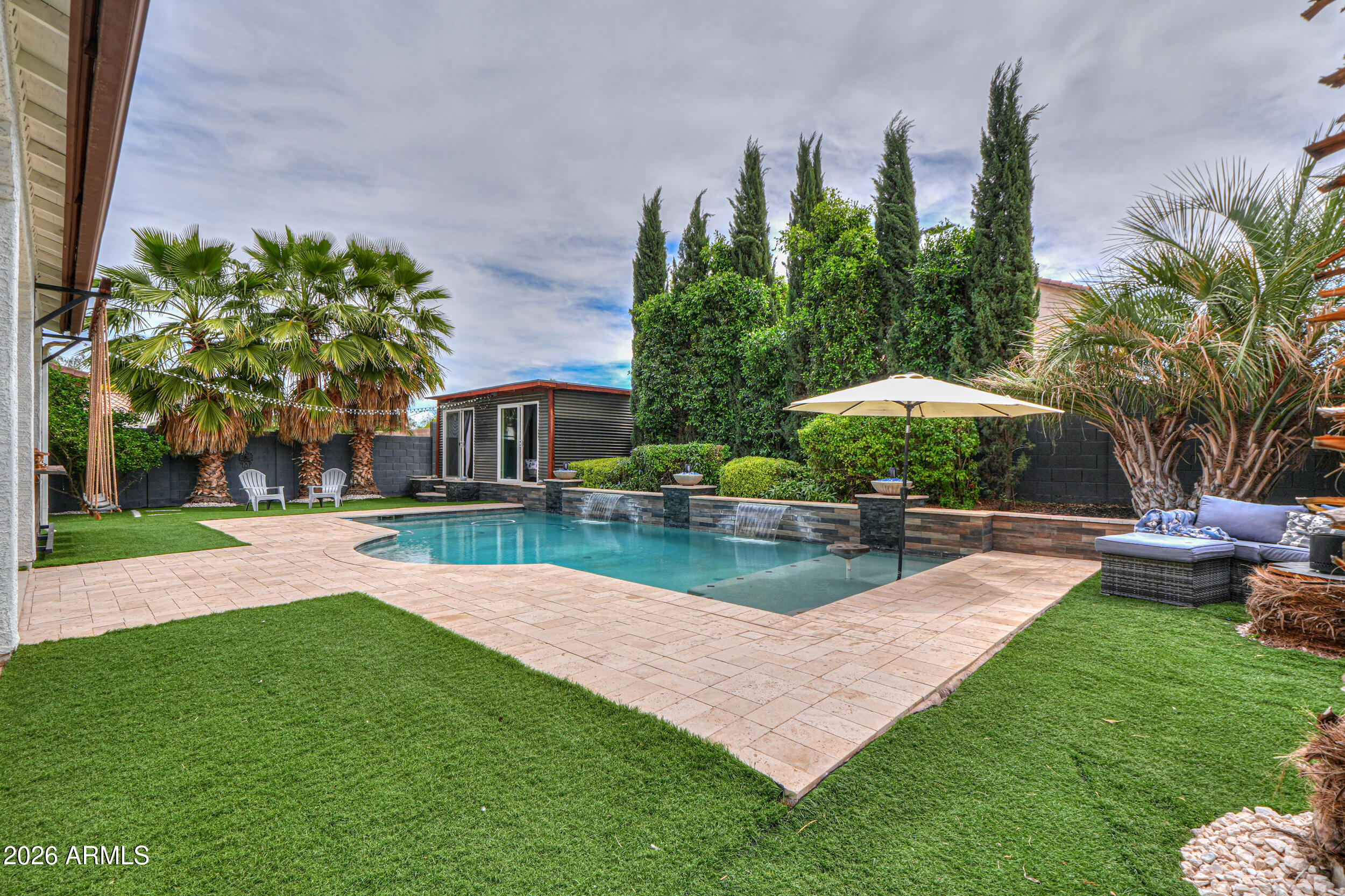 45247 West Jack Rabbit Trail Maricopa, AZ 85139 - Photo 65 of 75 a view of a house with garden and a patio