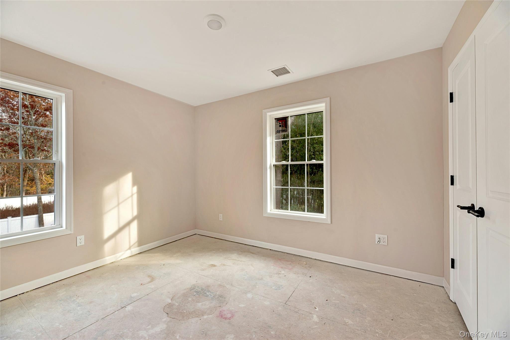 487 Neighborhood Road Shirley, NY 11967 - Photo 7 of 18 Spare room featuring baseboards