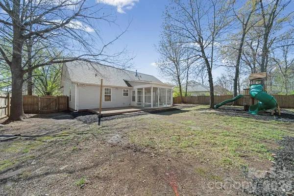 a house with trees in the background