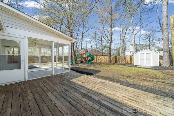 a house with view of trees in front of it