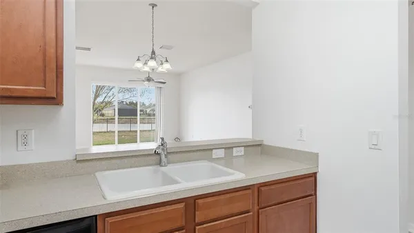 a kitchen with a sink and a window