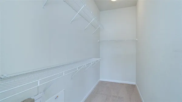 a view of an empty walk in closet