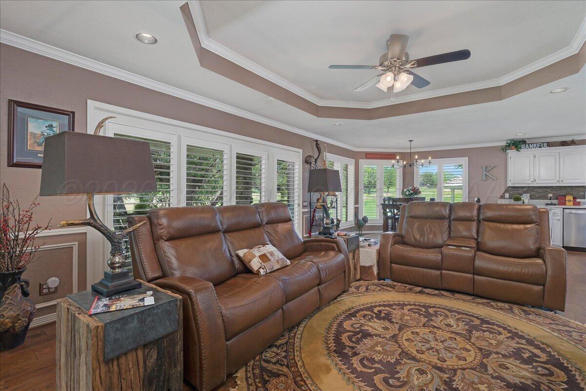 5 Locke Place Amarillo, TX 79124 - Photo 8 of 53 a living room with furniture a ceiling fan and a rug