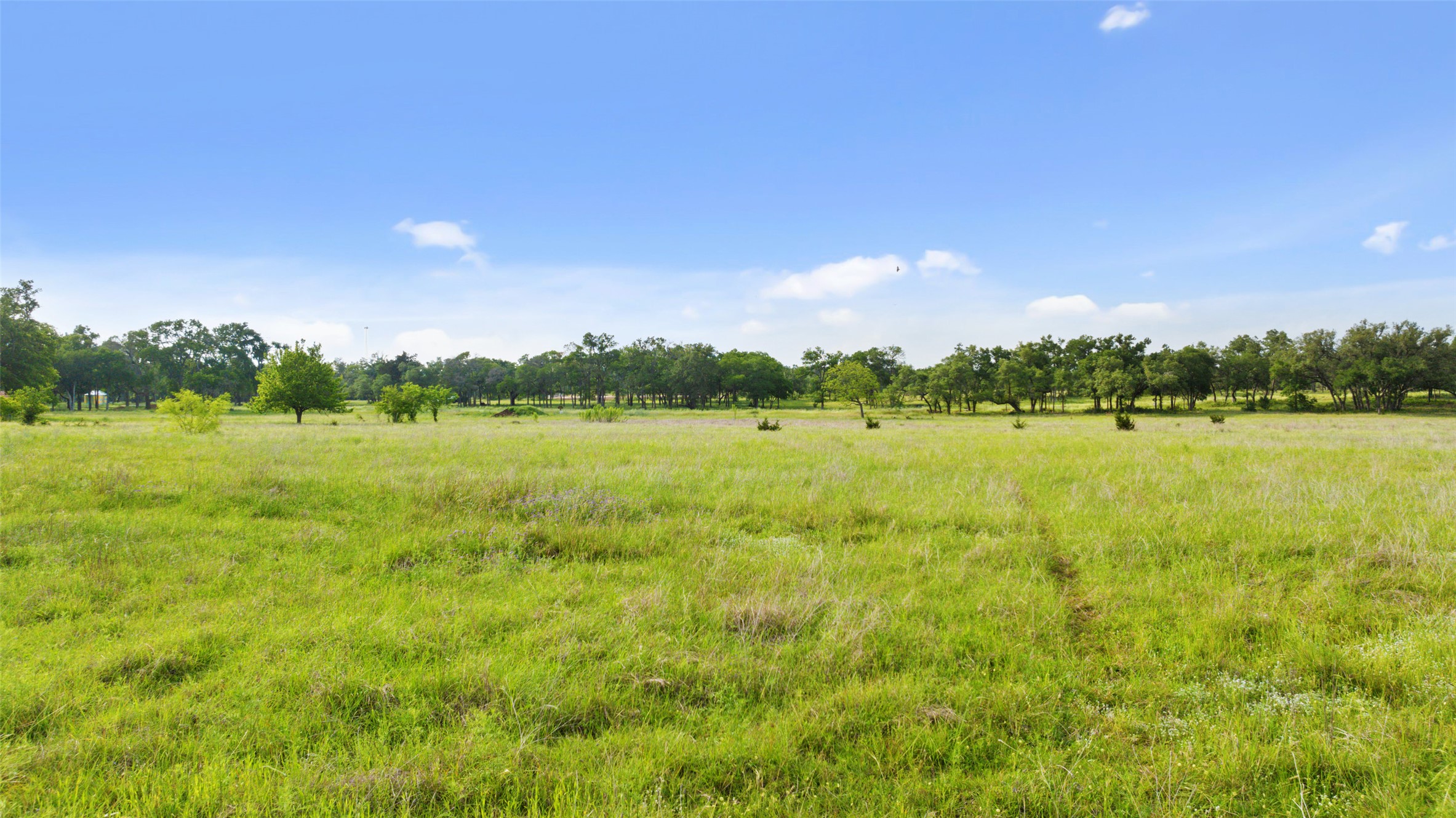 Lot 34 Mesa Rnch Road Dripping Springs, TX 78620 - Photo 7 of 15 a view of a lake with houses in the back