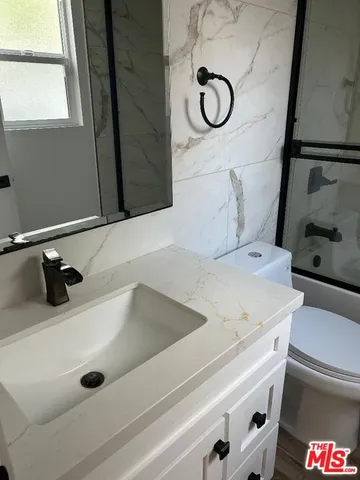 a bathroom with a tub and a sink