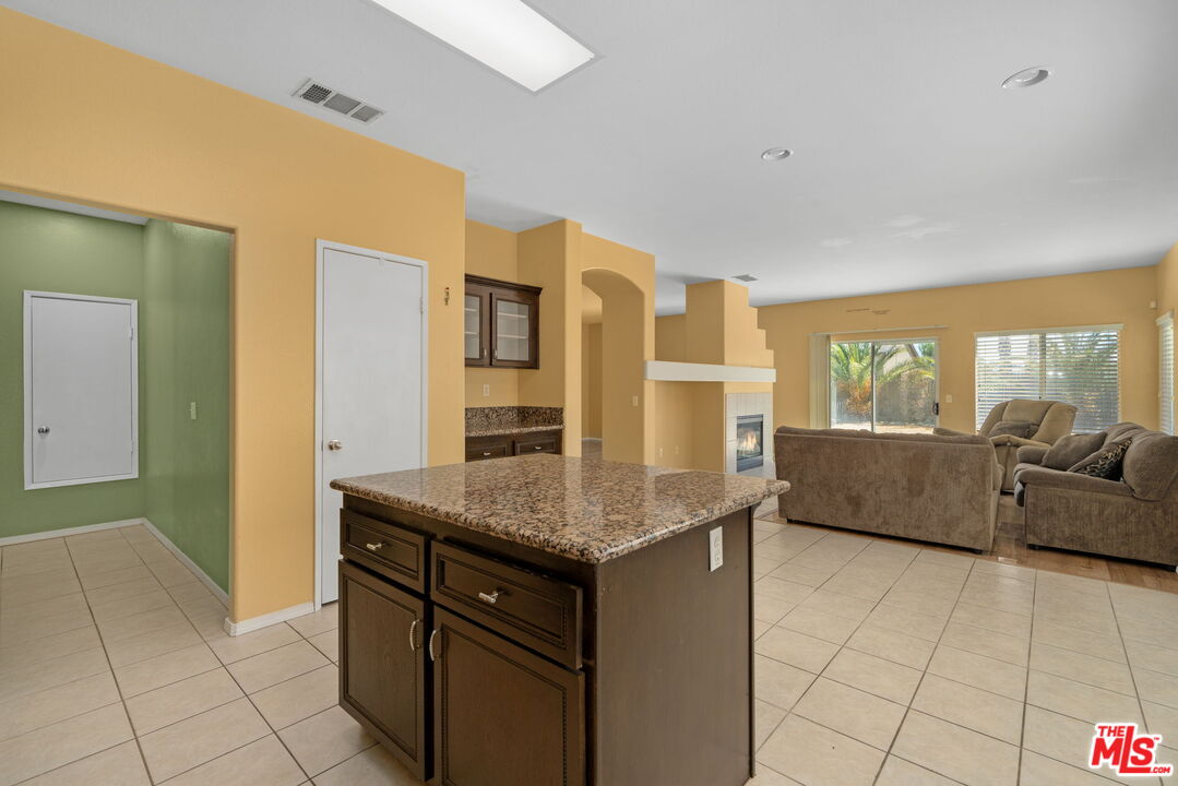 13623 Fox Point Road Victorville, CA 92392 - Photo 12 of 33 a living room with granite countertop furniture and fireplace