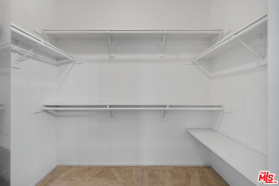 13623 Fox Point Road Victorville, CA 92392 - Photo 14 of 33 a view of an empty walk in closet