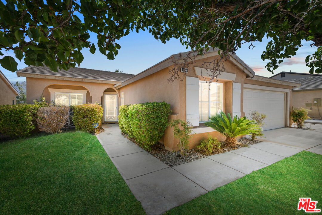 13623 Fox Point Road Victorville, CA 92392 - Photo 2 of 33 a front view of a house with garden