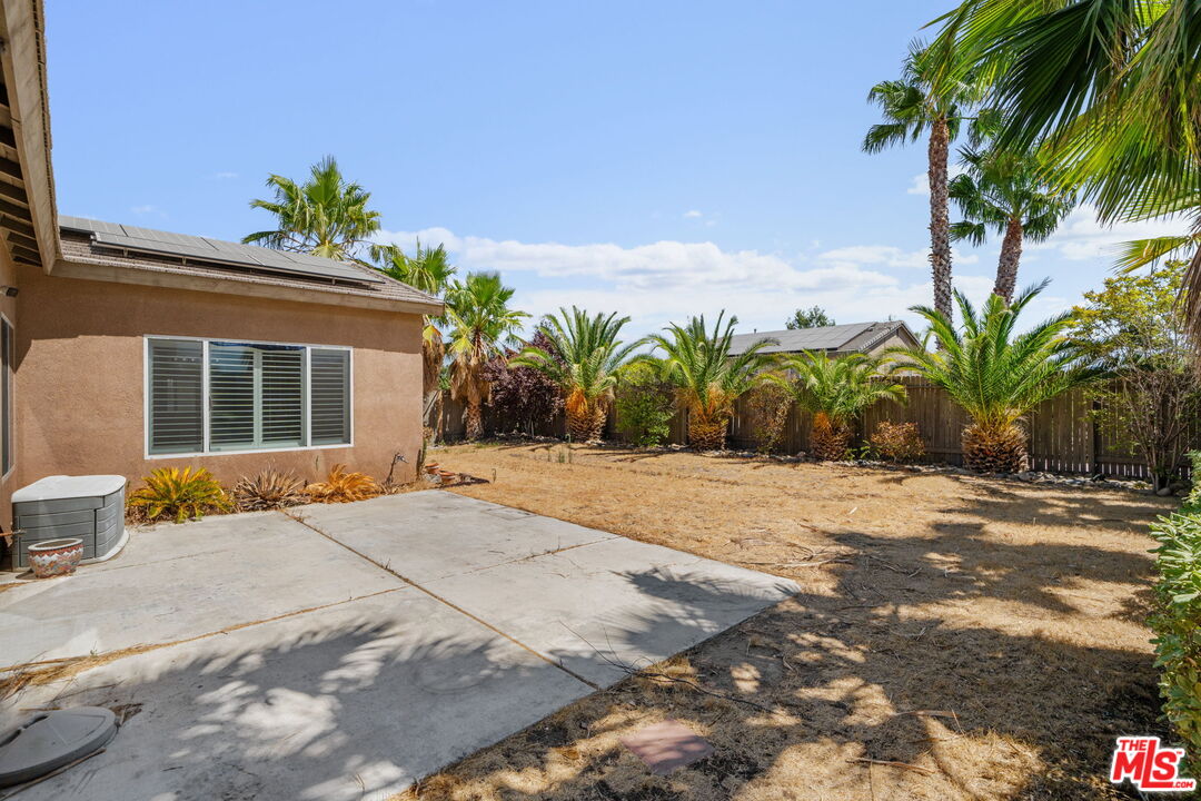 13623 Fox Point Road Victorville, CA 92392 - Photo 29 of 33 a front view of a house with a yard