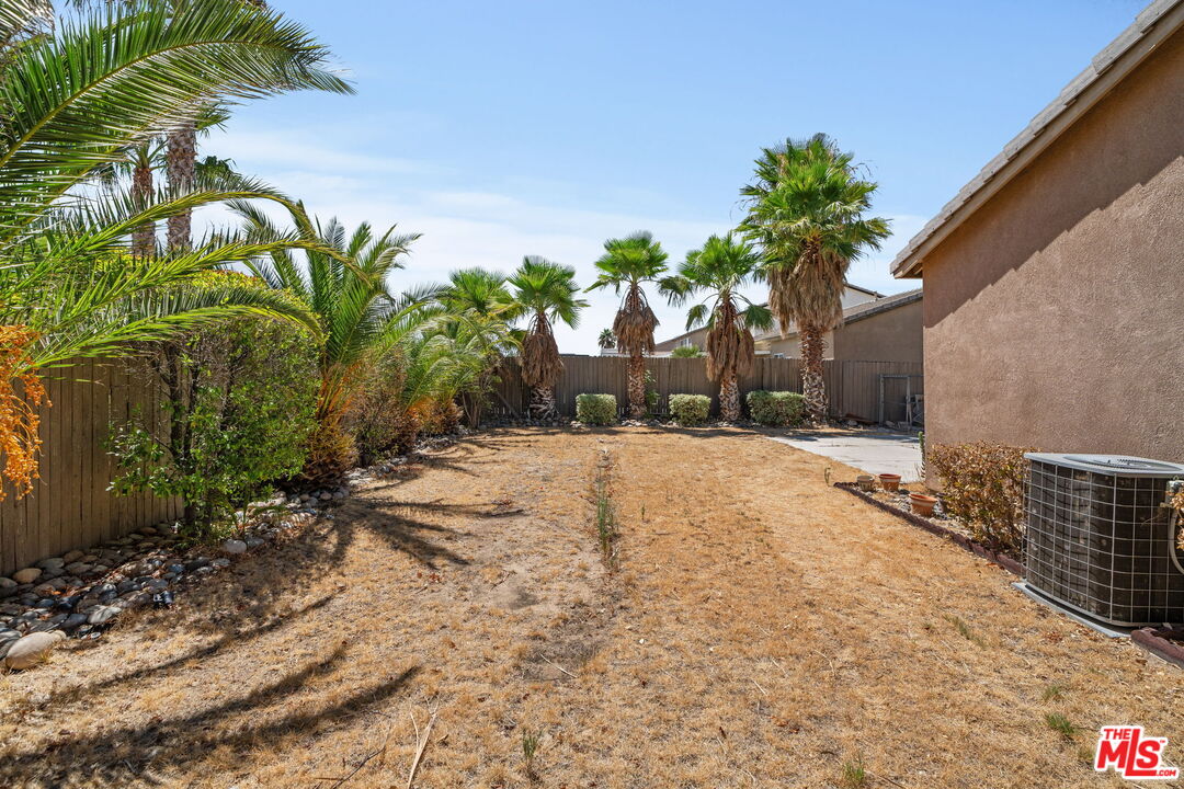 13623 Fox Point Road Victorville, CA 92392 - Photo 30 of 33 a view of a backyard with a garden