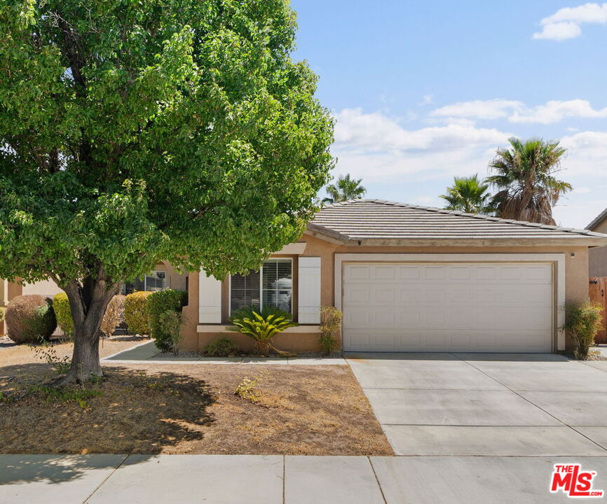 13623 Fox Point Road Victorville, CA 92392 - Photo 31 of 33 a front view of a house with garden