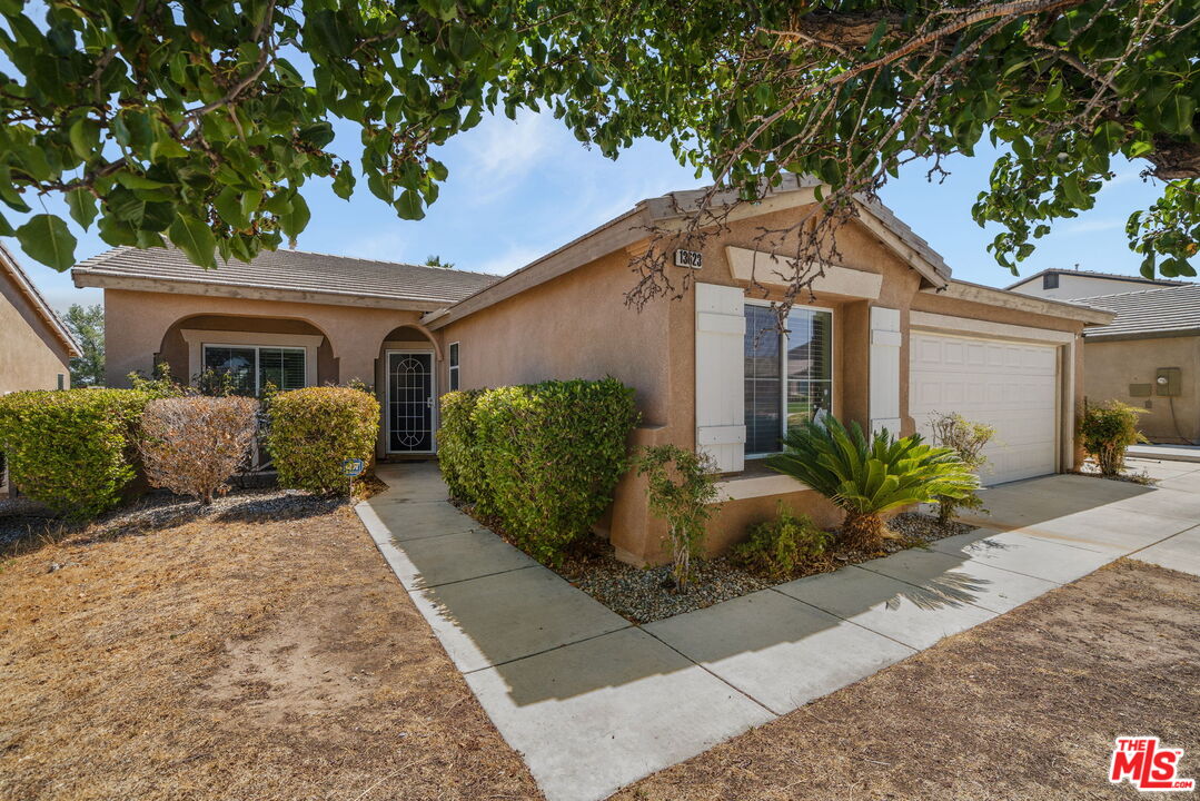 13623 Fox Point Road Victorville, CA 92392 - Photo 32 of 33 a front view of a house with garden