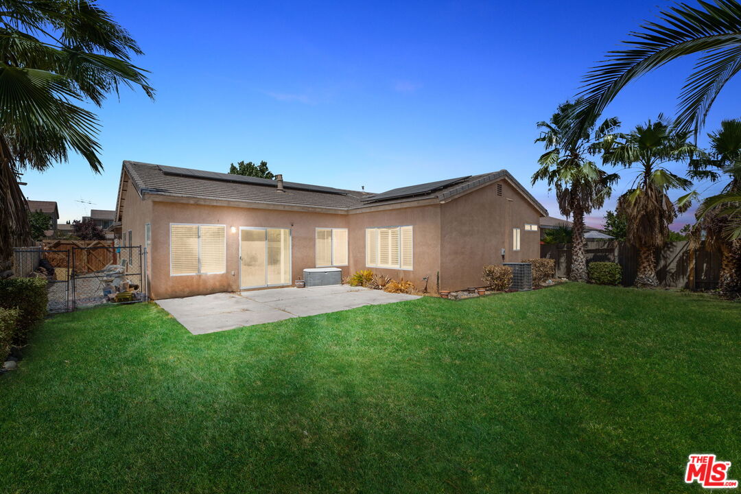 13623 Fox Point Road Victorville, CA 92392 - Photo 33 of 33 a front view of a house with a garden and yard