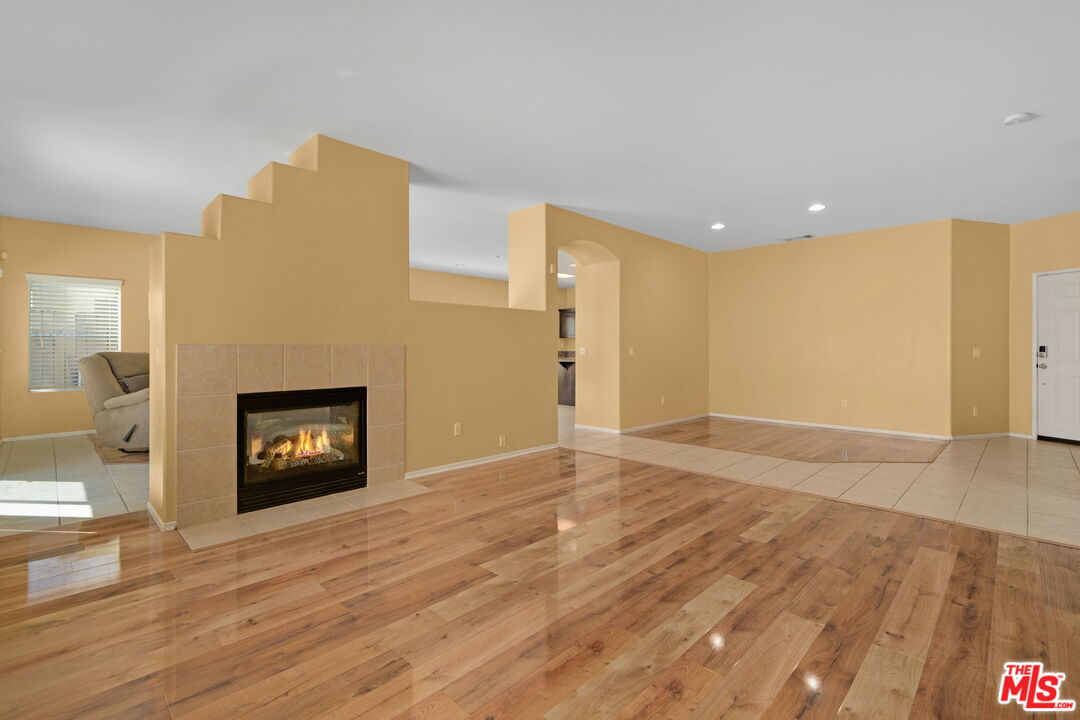 13623 Fox Point Road Victorville, CA 92392 - Photo 5 of 33 a view of a livingroom with a fireplace