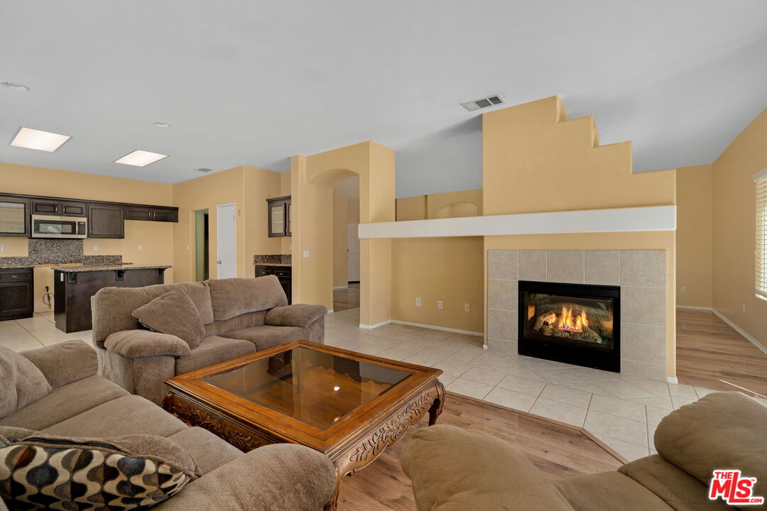 13623 Fox Point Road Victorville, CA 92392 - Photo 9 of 33 a living room with furniture and a fireplace
