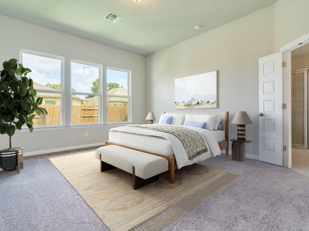270 Rimrock Court Bastrop, TX 78602 - Photo 5 of 34 The primary suite is a true retreat, complete with a large walk-in closet, dual vanity, and walk-in shower.